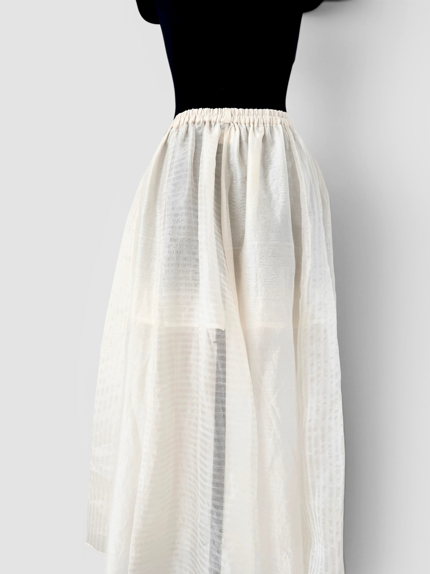 Ivory panelled skirt and peplum belt